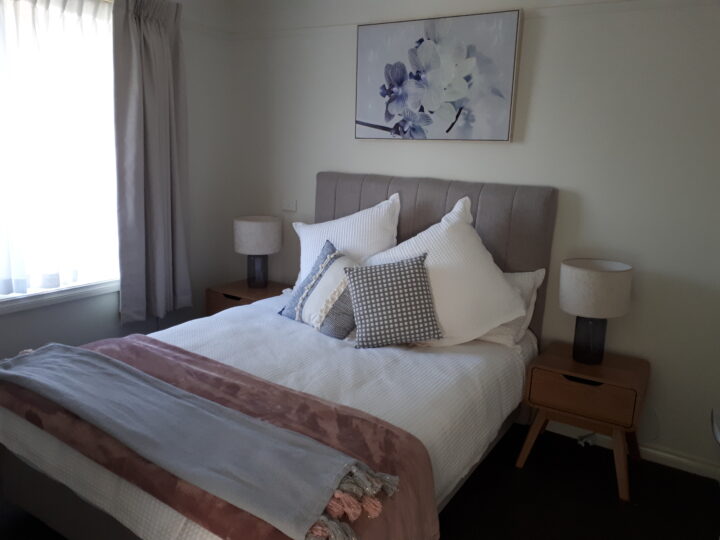 Master bedroom in pink and grey colour scheme at Mercy Place Rice Village retirement