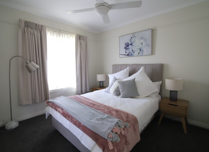 Master bedroom in pink and grey colour scheme in a unit at Mercy Place Rice Village retirement