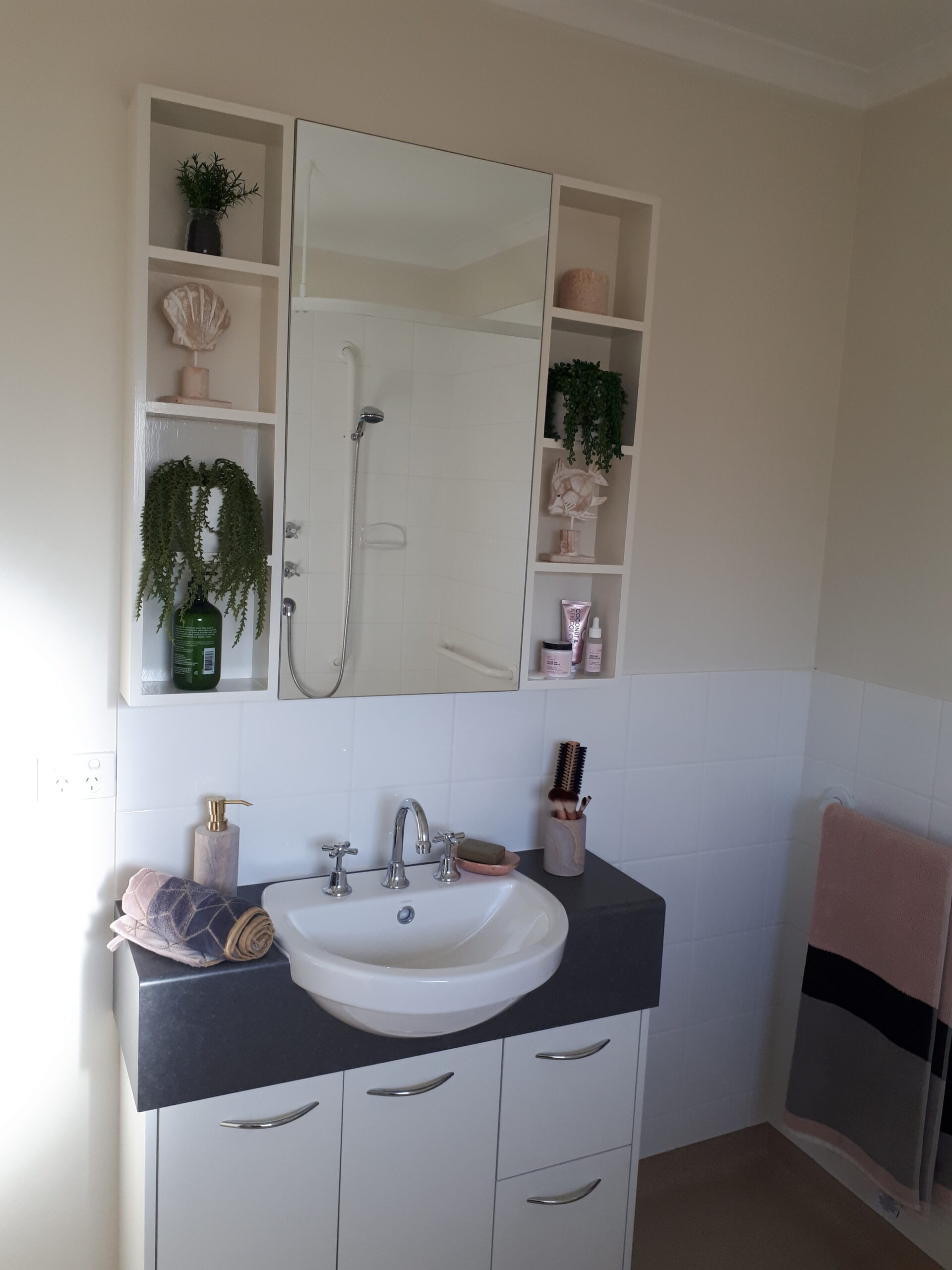 Modern white and grey bathroom at Mercy Place Rice Village retirement